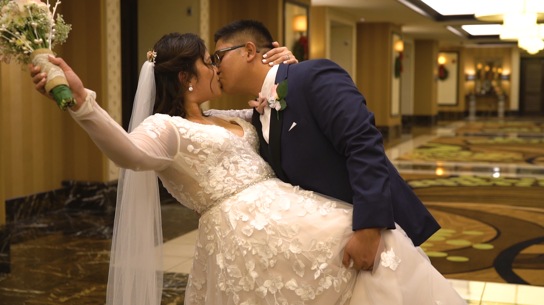 Couple kisses at their wedding
