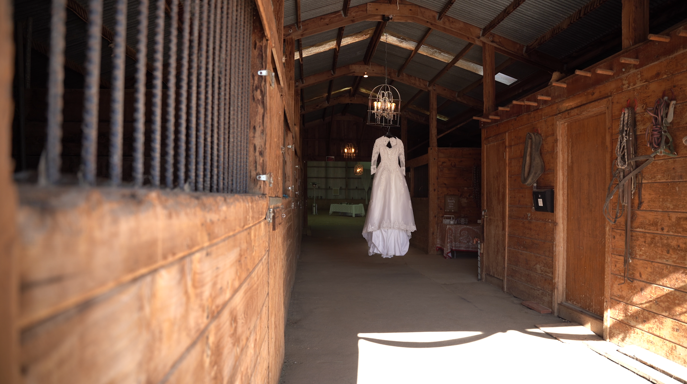 White Wedding dress hanging in barn